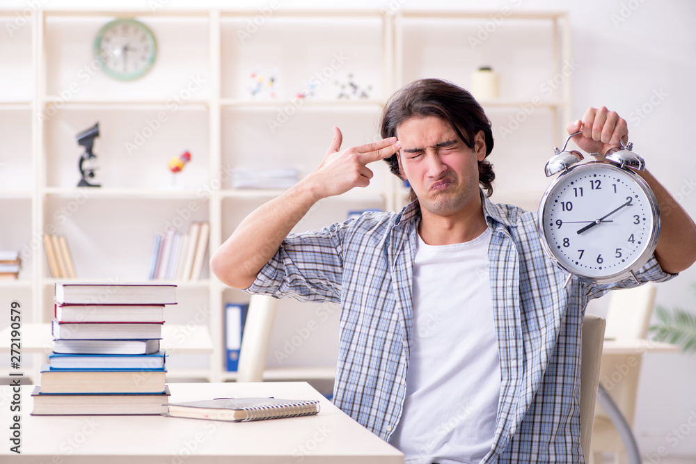 Young male student preparing for exams at home Young male student preparing for exams at home