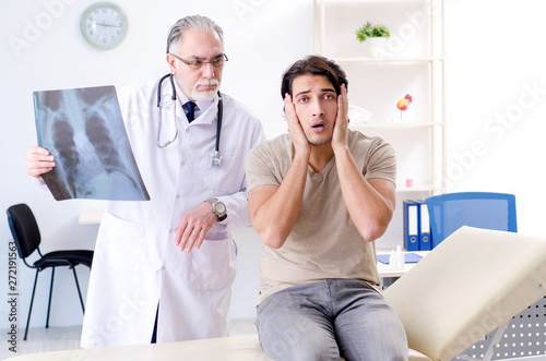 Young man visiting old male doctor radiologist 