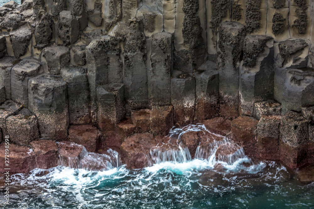 Volcanic pillar cliff near sea shore seaside in Jusangjeolli Seogwipo Jeju South Korea