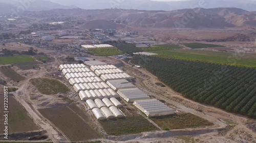 Flying above farming agricultural tents in south Israel kibbutz 4k aerial