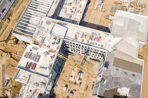 aerial top view of city construction site. modern public building under construction