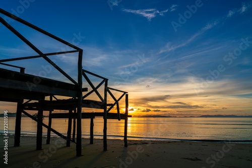 Wooden porch by the sea in sunrise or sunset time beautiful light of nature