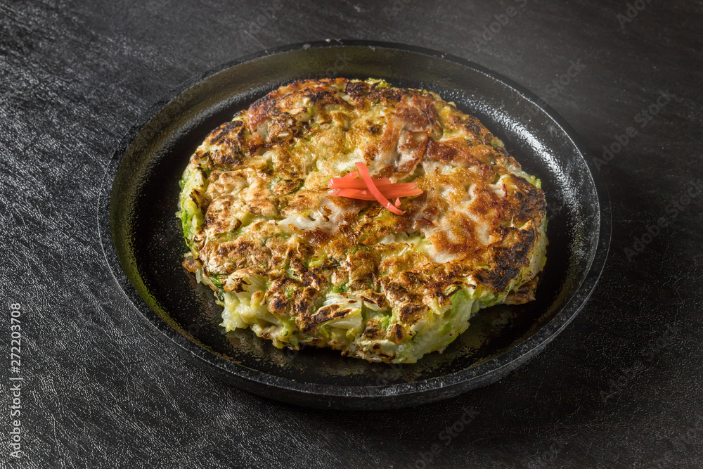 お好み焼き  Okonomiyaki is a Japanese-style pancake