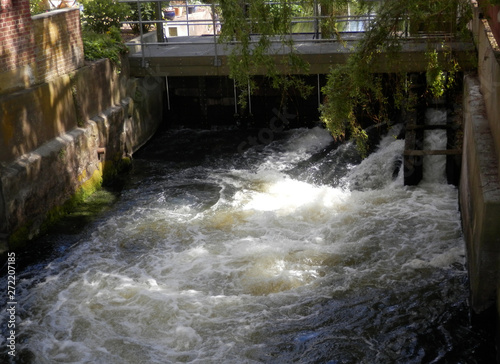 Danish waterway sluice with gushing water photo