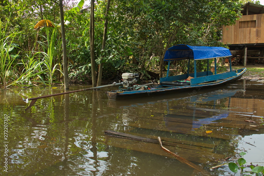 Motor boat in the village San Antonio de Cacao at Amazonas river in Peru Motor boat in the village San Antonio de Cacao at Amazonas river in Peru