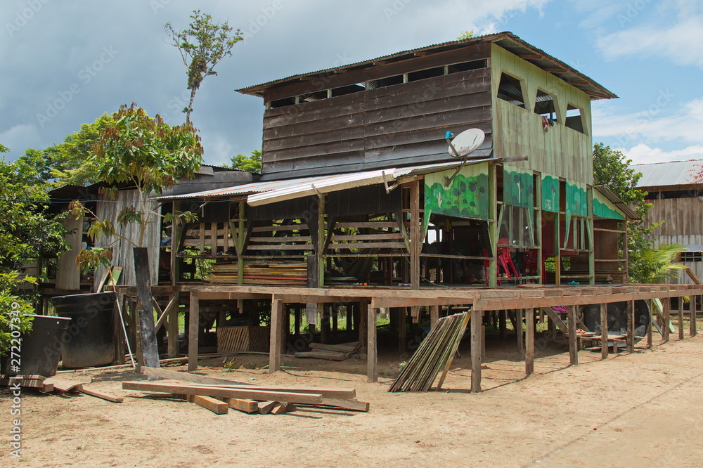 Houses in the village San Antonio de Cacao at Amazonas river in Peru Houses in the village San Antonio de Cacao at Amazonas river in Peru