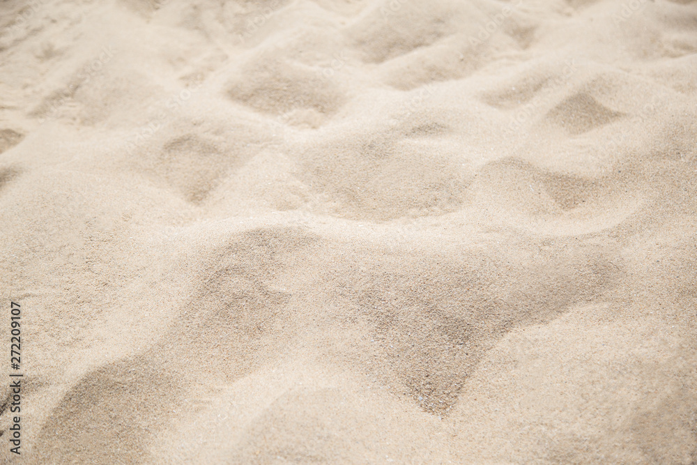 Fine beach sand in the summerBackground with copy space and visible sand texture. Fine beach sand in the summerBackground with copy space and visible sand texture.