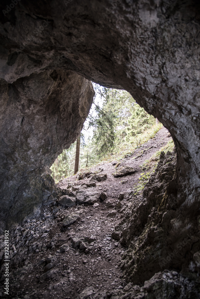 Obraz premium hiking trail through small cave bellow Poludnica hill in Nizke Tatry mountains in Slovakia
