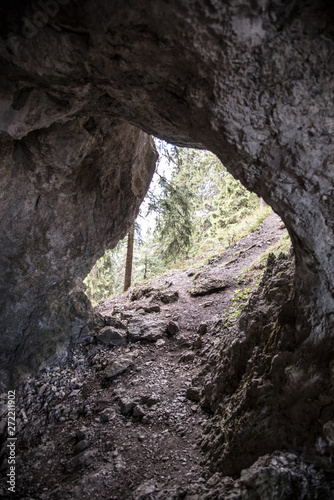 hiking trail through small cave bellow Poludnica hill in Nizke Tatry mountains in Slovakia © honza28683