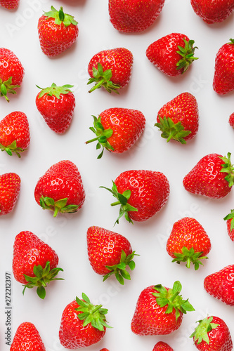 Background made from red ripe strawberry on the light background, close up shoot