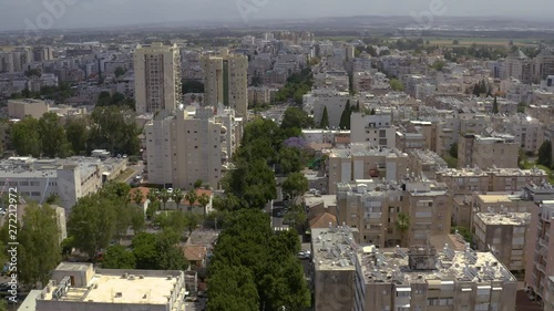 Petah Tikva city, Israel, city streets residential area and road traffic aerial drone skyline view 4k  photo