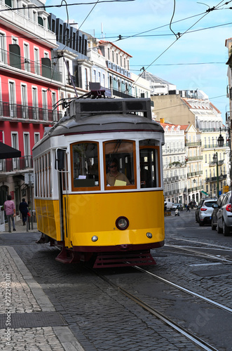 an old yellow tram in Lisbon, Portugal