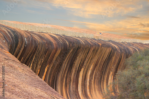 Huge rock formation (granite inselberg) shaped  like a breaking wave (Wave Rock, Hyden, Western Australia)