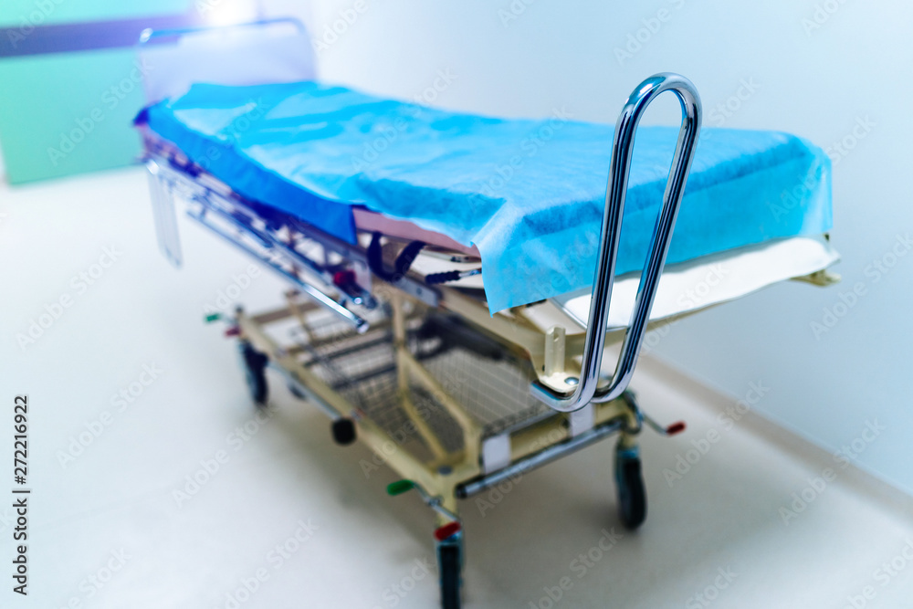 Modern hospital bed. Empty hospital hallway. Modern hospital bed. Empty hospital hallway.