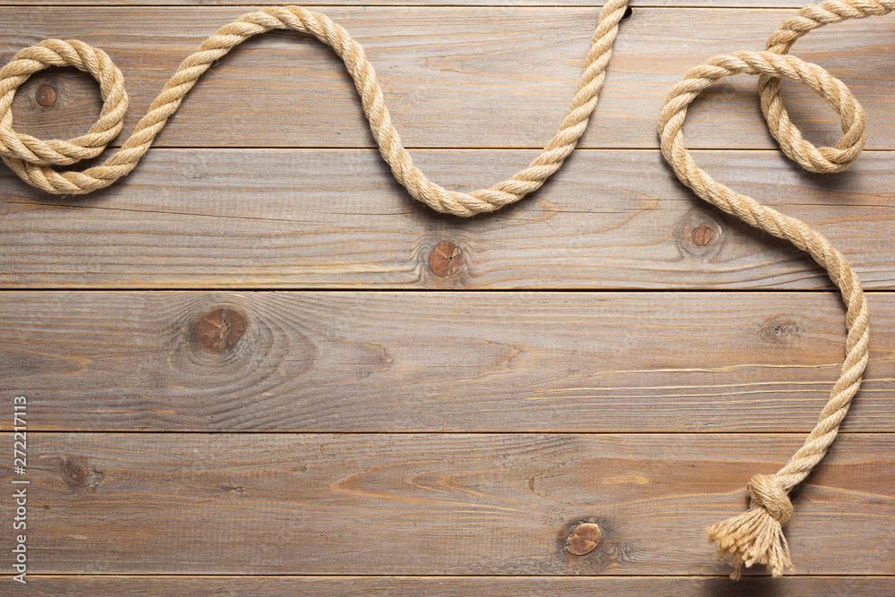 ship rope at wooden background texture ship rope at wooden background texture