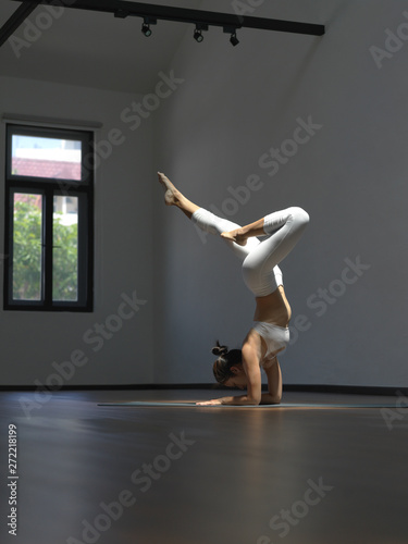 Asian chinese single woman in white practising Yoga