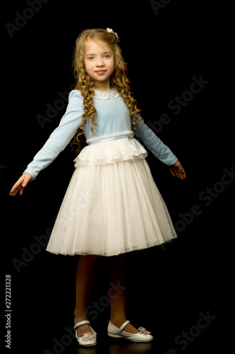 Little girl on a black background