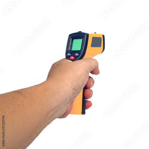 Yellow Infrared thermometer gun in hand used to measure temperature on white background.