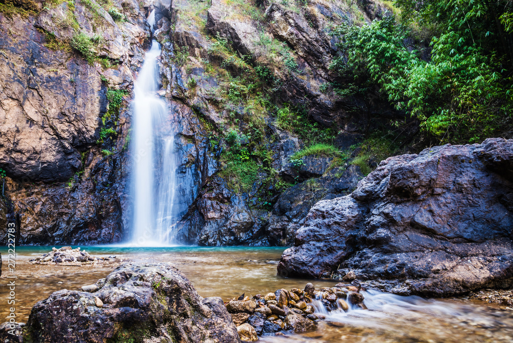 Obraz premium Natural background Landscape photo jogkradin in the deep forest at Kanchanaburi in Thailand. Emerald waterfall, travel nature, Travel relax, Travel Thailand, Waterfall picture, Landscape photo.