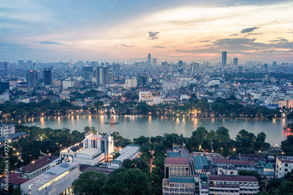 Aerial skyline view of Hoan Kiem lake or Ho Guom, Sword lake area at twilight. Hoan Kiem is center of Hanoi city. Hanoi cityscape.