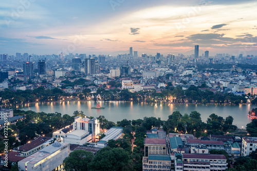 Aerial skyline view of Hoan Kiem lake or Ho Guom, Sword lake area at twilight. Hoan Kiem is center of Hanoi city. Hanoi cityscape.