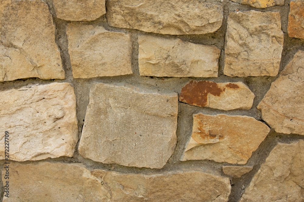 The wall is decorated with stone stones, beautiful texture. The wall is decorated with stone stones, beautiful texture.