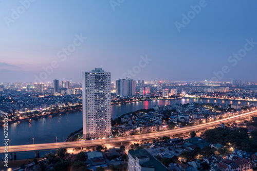 Aerial skyline view of Hanoi at Linh Dam lake, Belt Road No. 3. Hanoi cityscape by sunset period