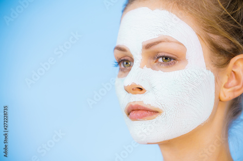 Girl with dry white mud mask on face