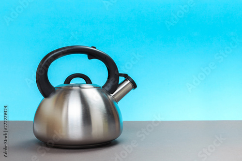 a new metal kettle for a gas stove on a gray table