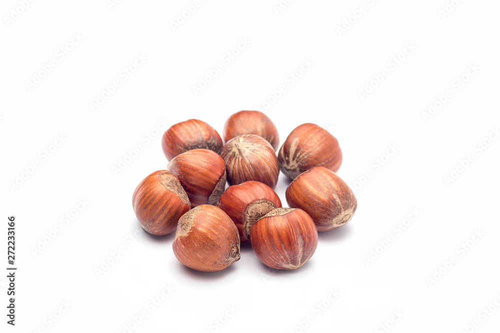 Group of hazelnuts in a shell isolated on a white background Group of hazelnuts in a shell isolated on a white background
