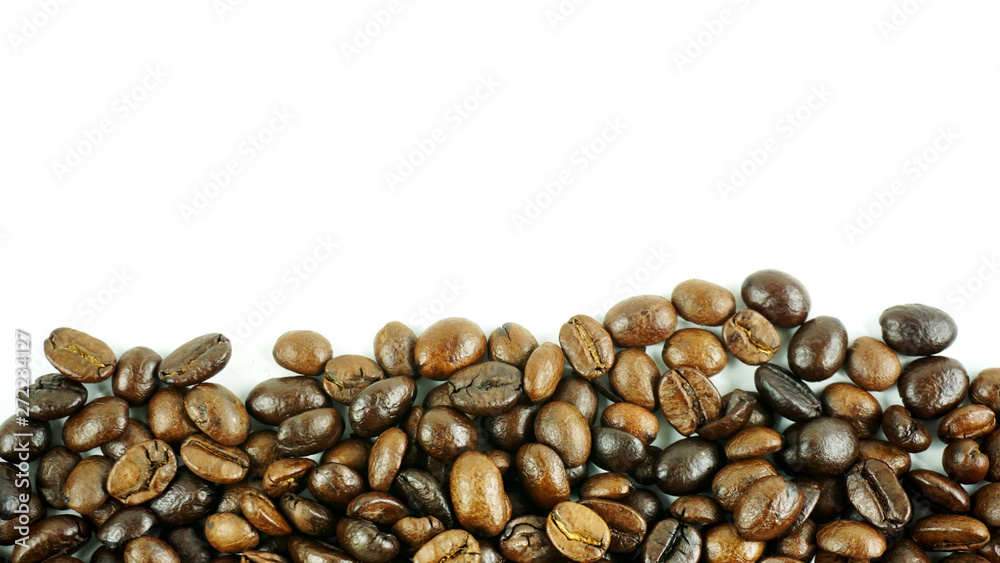 Many coffee beans on a white background with copy space for your text. Many coffee beans on a white background with copy space for your text.