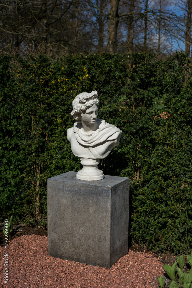 Flower garden, Netherlands , a large stone statue in a park