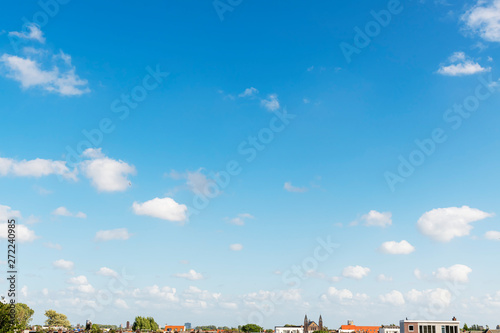 Papier peint Small and compact group cumulonimbus clouds floating in the blue cyan pur gradie