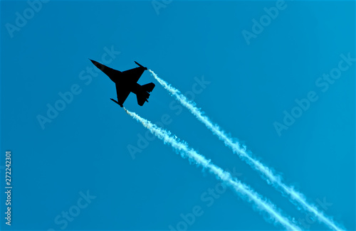 F16 backlit in Blue sky