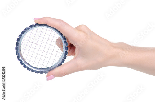 Metal grid vegetable cutter in hand on white background isolation