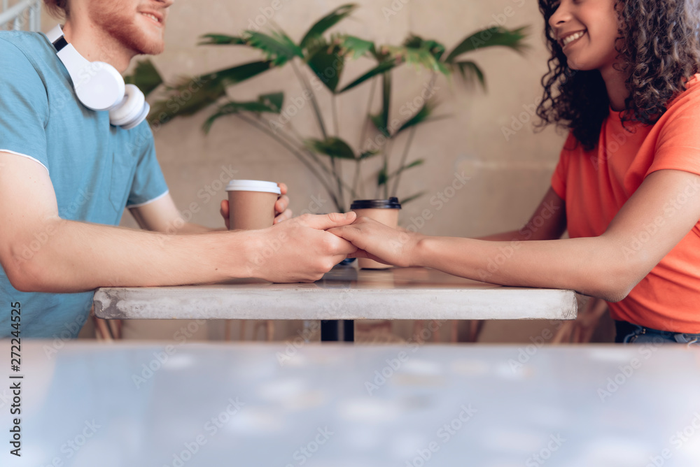 Happy young couple is having date in cafe Happy young couple is having date in cafe