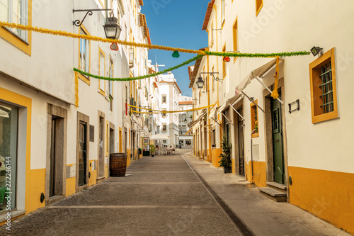 Streets of Evora, Portugal. White and yellow houses on a sunny day