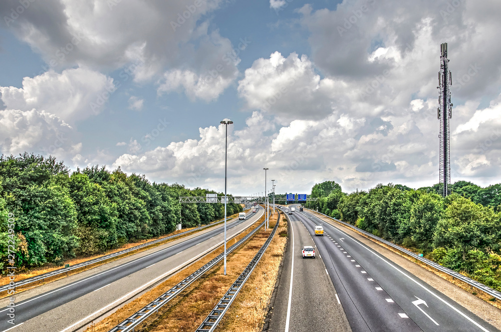 View from a viaduct towards the A58 highway with forests on both sides near Breda the Netherlands