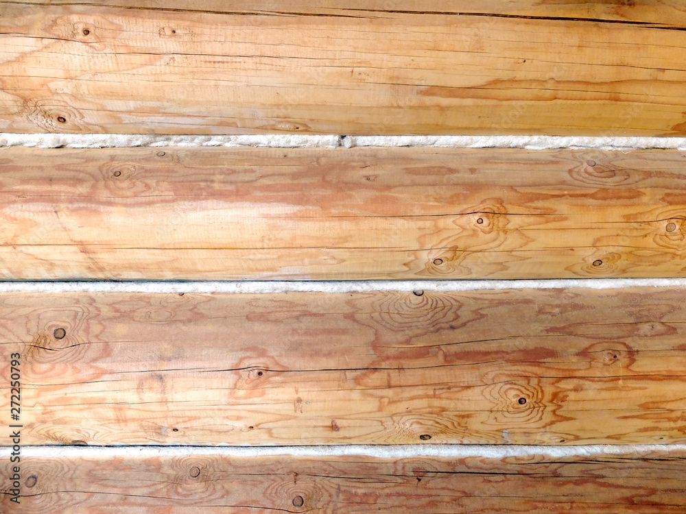The texture of the wall of wooden logs
