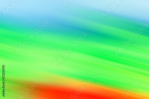 Fast camera movement. Strong blurred abstract background. Green, Blue, Red color.