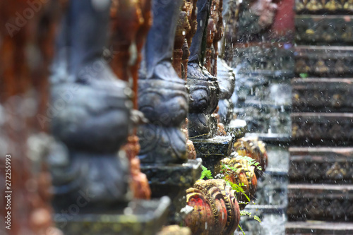 Columns in an Asian park with a waterfall, travel and life