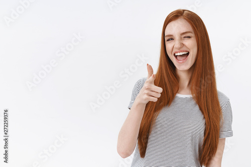 Fotografie Cheeky good-looking redhead woman straight ginger hair sassy wink camera show th