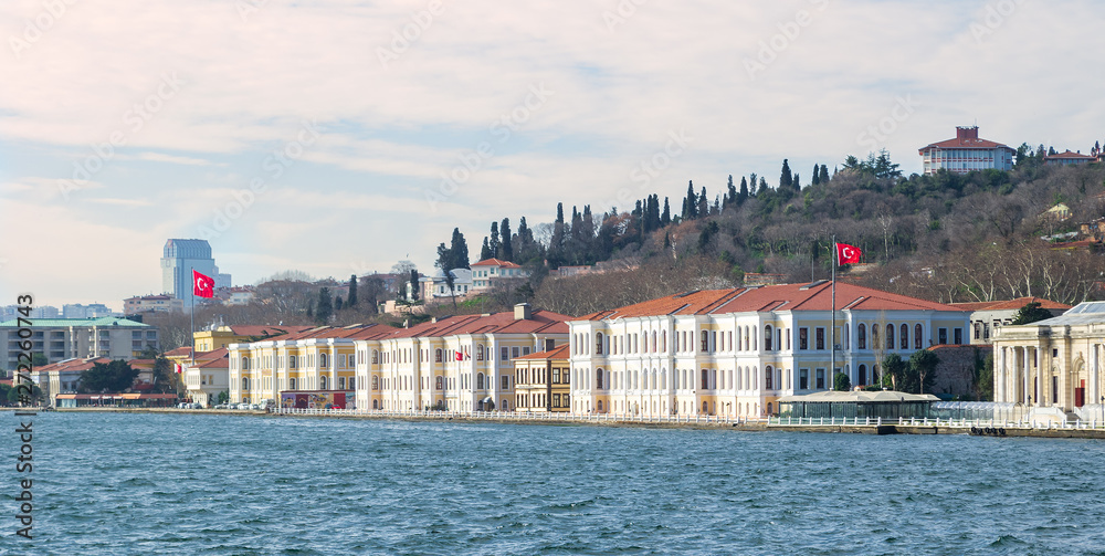 Fototapeta premium Waterfront buildings against the backdrop of hills near Bosphorus bridge in Istanbul, Turkey