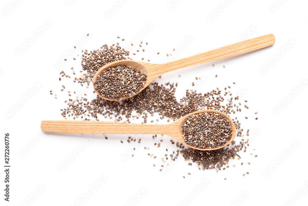 Chia seeds in a wooden spoons isolated on white background Chia seeds in a wooden spoons isolated on white background