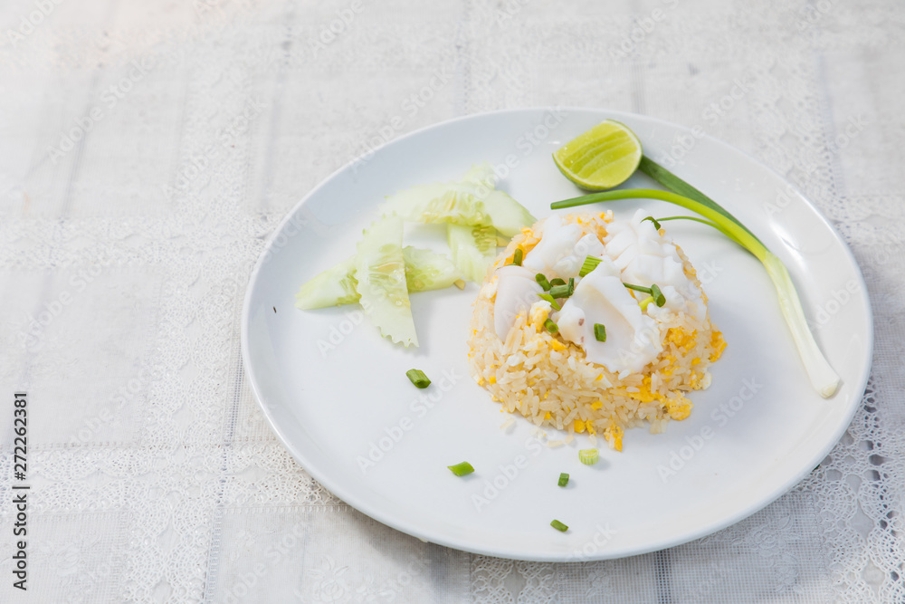 Fried rice with Squid on the wooden table from top view Fried rice with Squid on the wooden table from top view