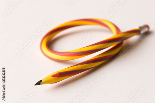 Flexible pencil . Isolated on white background. Bending pencil