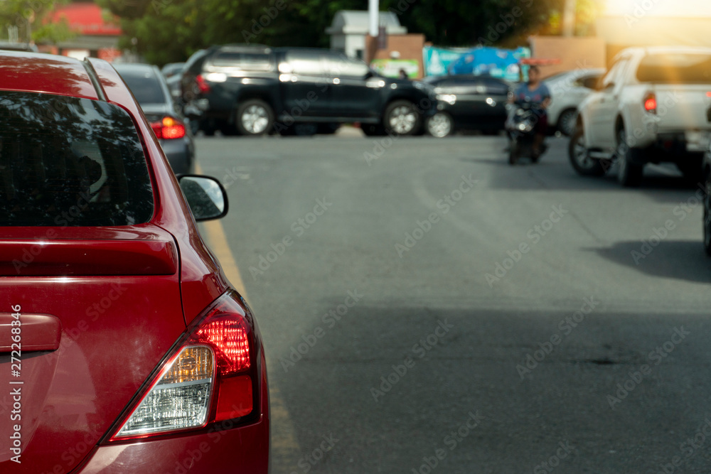 Break of red cars on asphalt roads during rush hours for travel or business work.