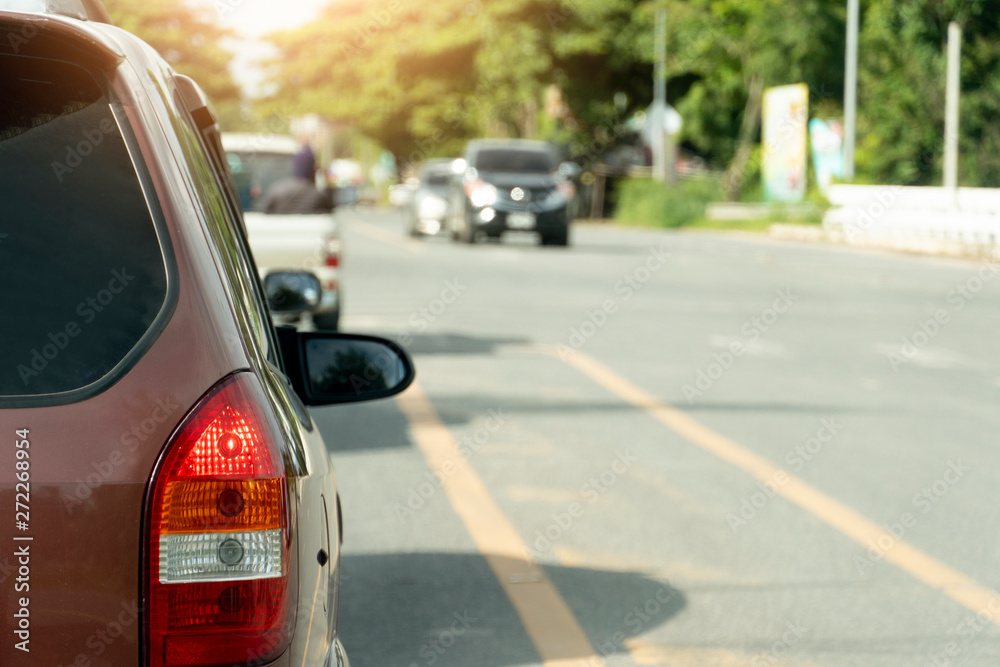 Break of red car on asphalt roads during rush hours for travel or business work. Break of red car on asphalt roads during rush hours for travel or business work.