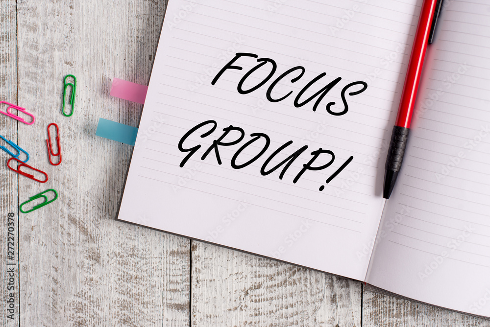 Conceptual hand writing showing Focus Group. Concept meaning showing assembled to participate in discussion about product Notebook stationary placed above classic wooden backdrop Conceptual hand writing showing Focus Group. Concept meaning showing assembled to participate in discussion about product Notebook stationary placed above classic wooden backdrop