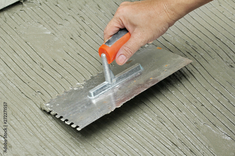 Stockfoto Homemade Replacing floor tiles , Fill tile adhesive plaster